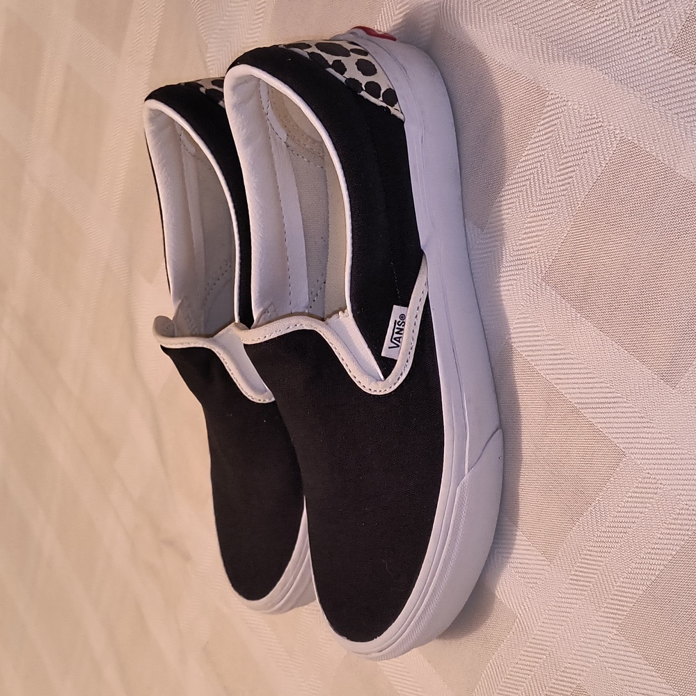 Vans Black and White Slip-On Sneakers